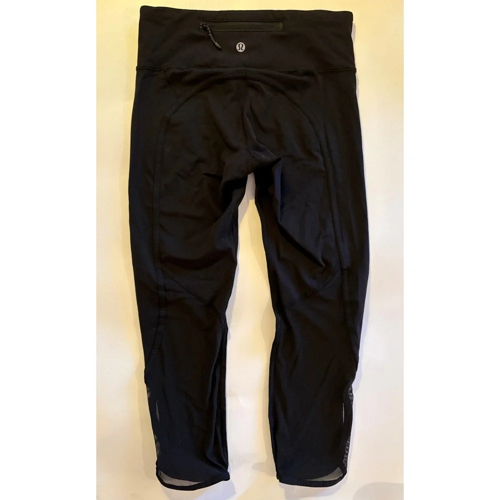 Lululemon Women's Black Crop Leggings Back Zip Pocket  Mesh Panel Running size 4